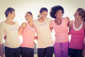 Laughing women wearing pink for women's health in parkland