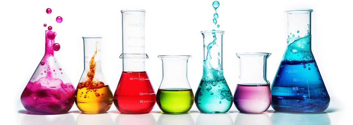 test-tubes-of-different-shapes-and-sizes-with-different-colored-liquid-on-a-plain-background