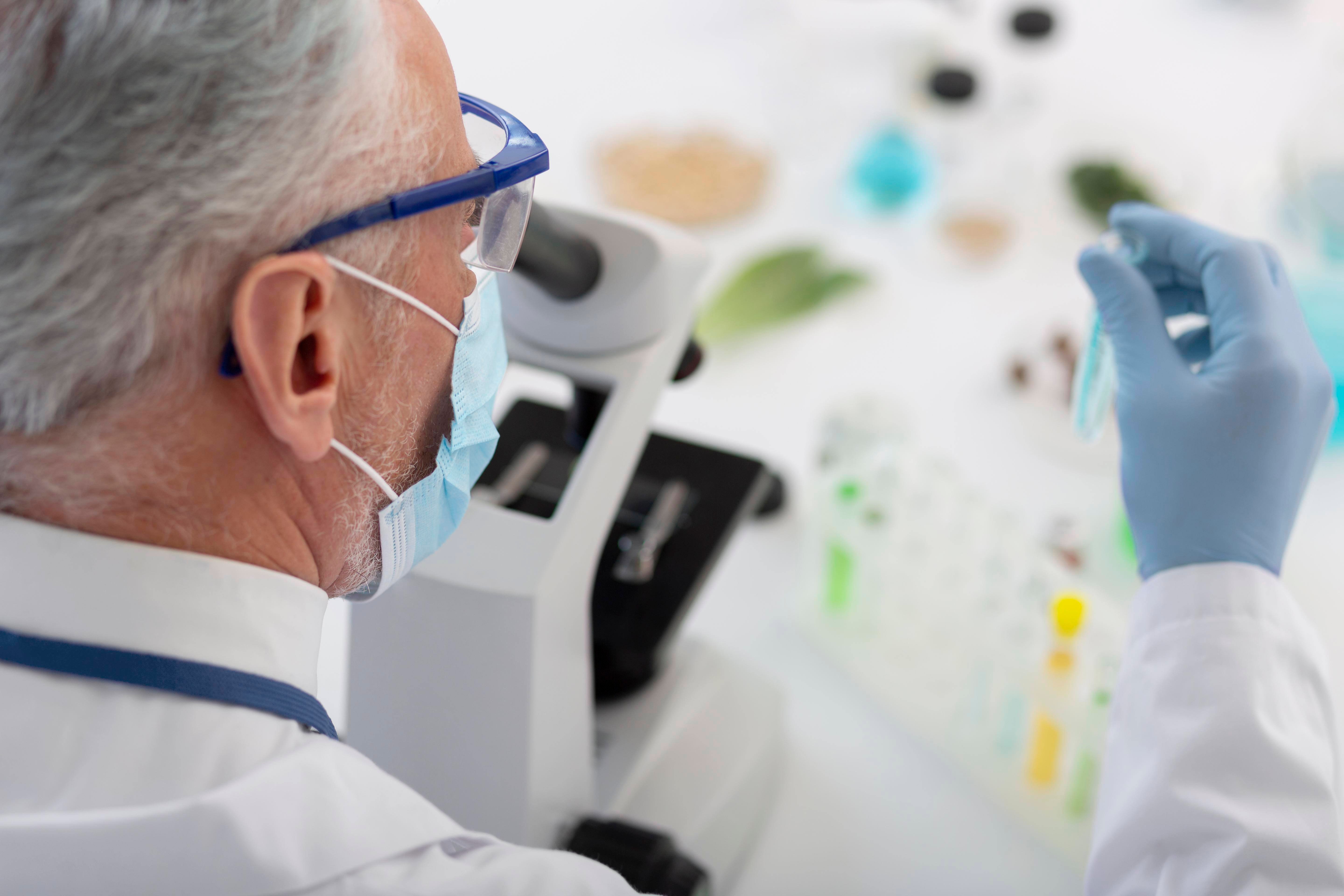 close-up-scientist-working-with-microscope