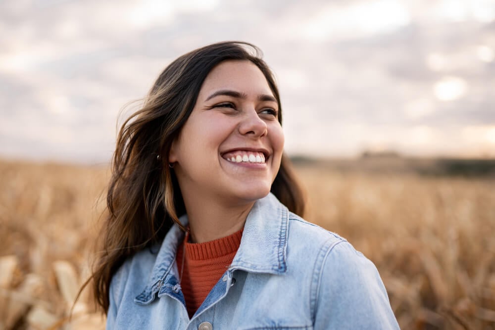 beautiful-young-latin-woman-outdoors-portrait-on-farmland