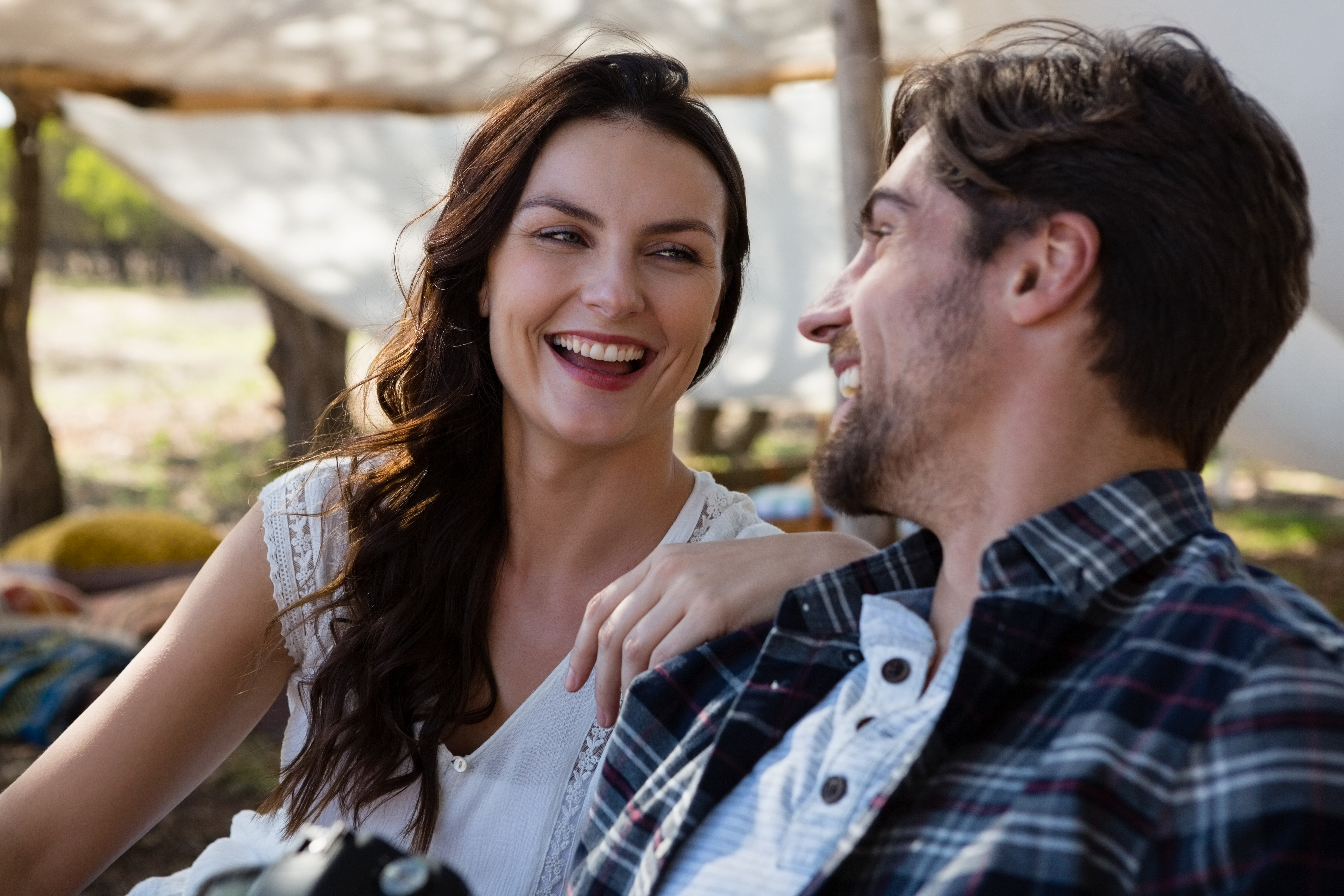 cheerful-couple-outside-tent (1)