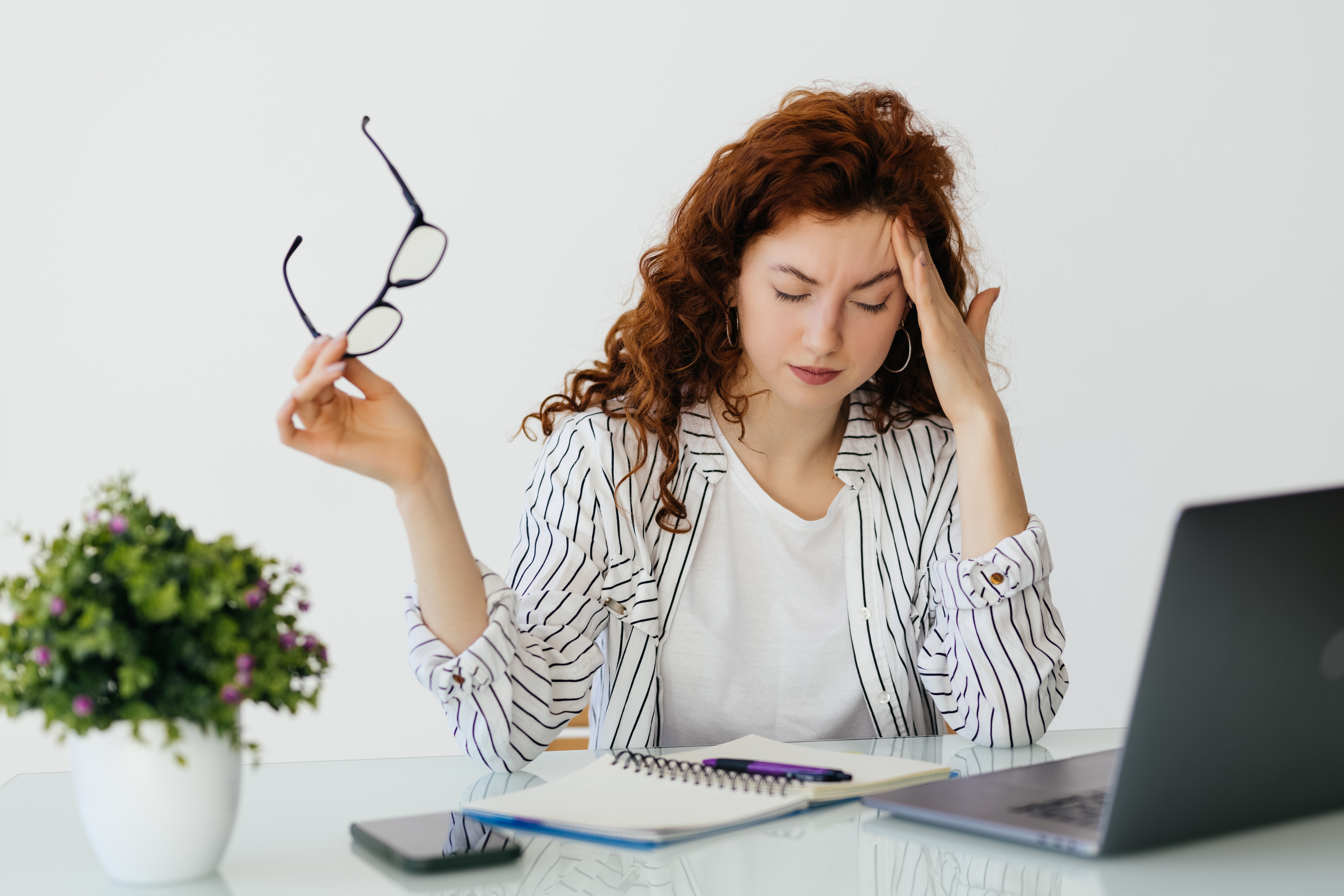 ginger-tired-woman-working-laptop-drinking-coffee-office-archive-accounting-business (1)