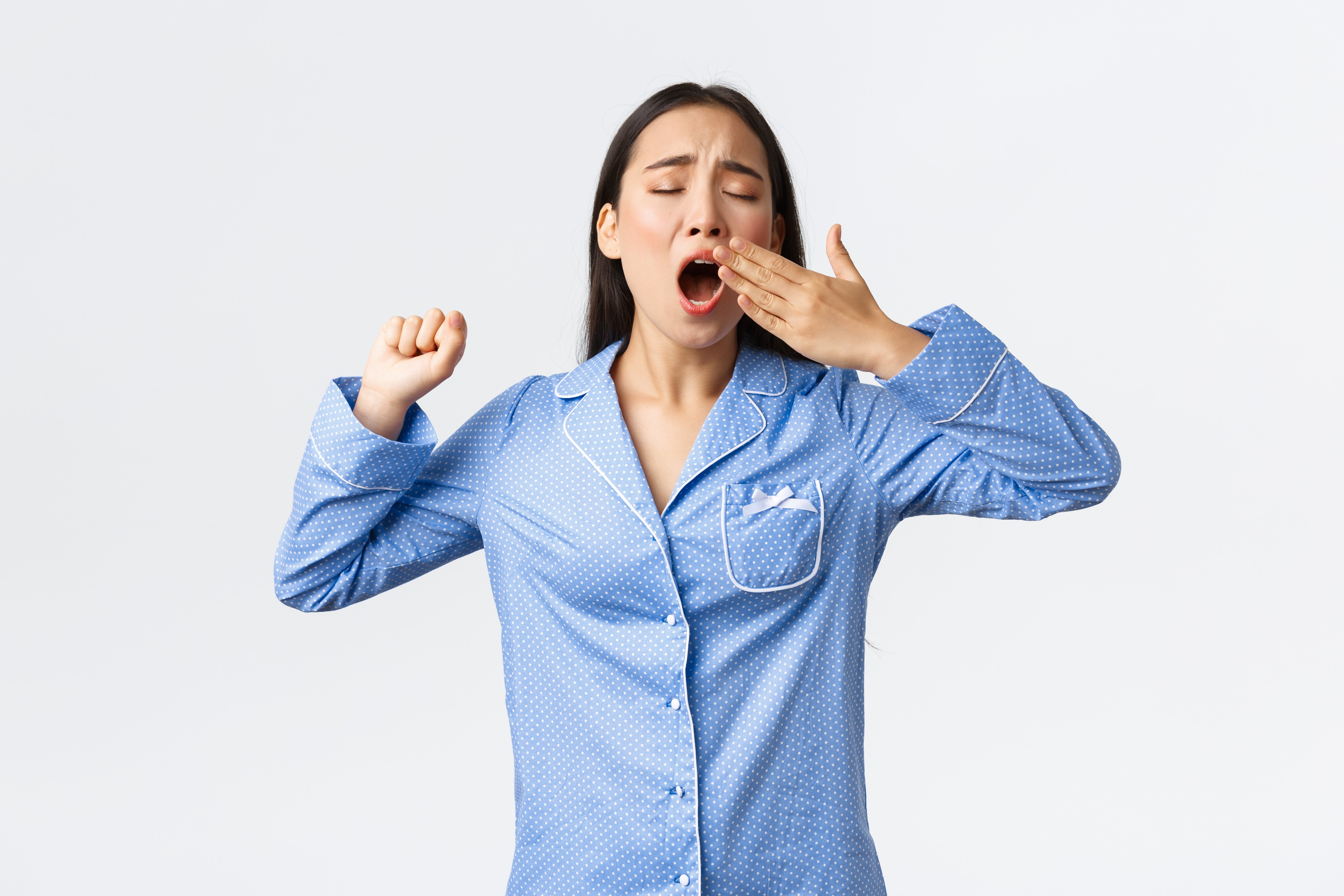 sleepy-asian-teenage-girl-pajamas-yawning-stretching-waking-up-early-from-alarm-tired-cute-woman-jammies-standing-white-background-wanting-sleep